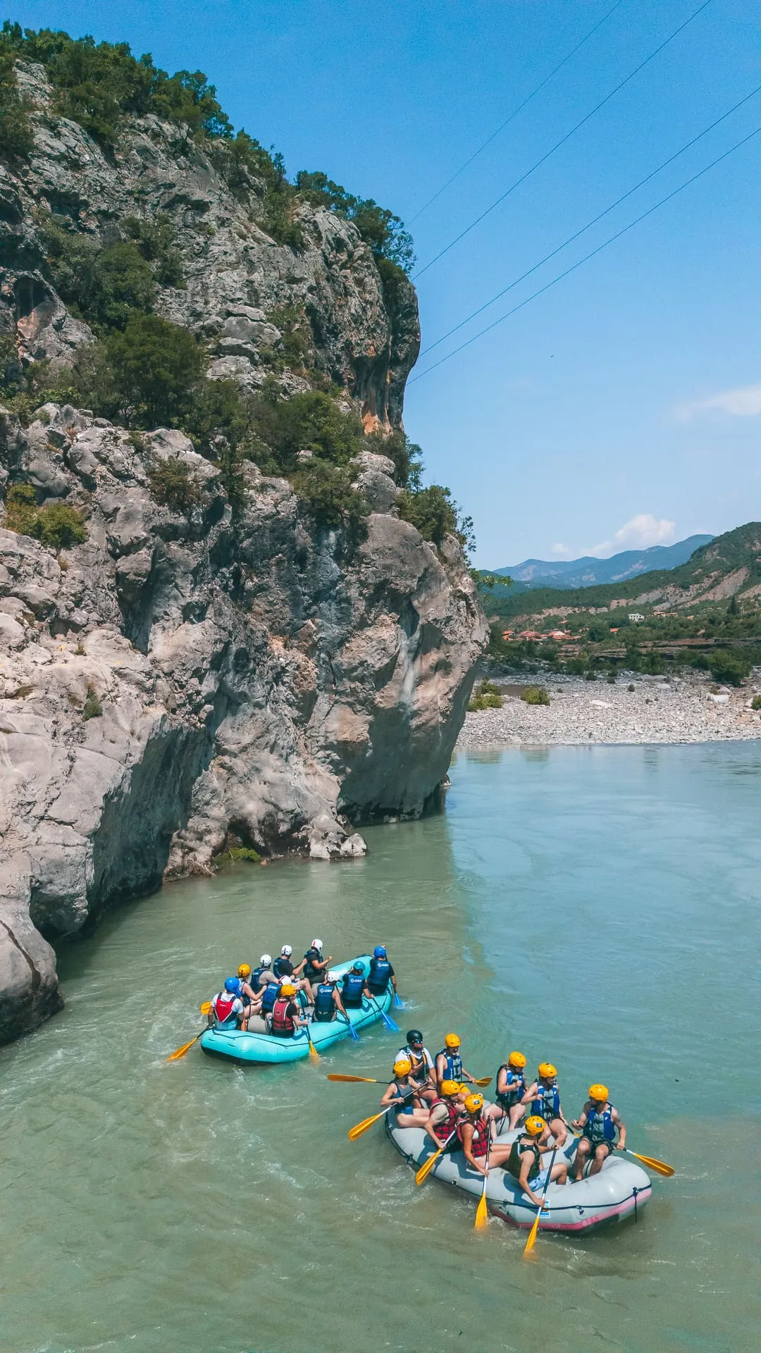 Kayakers on the calm blue water of the river
