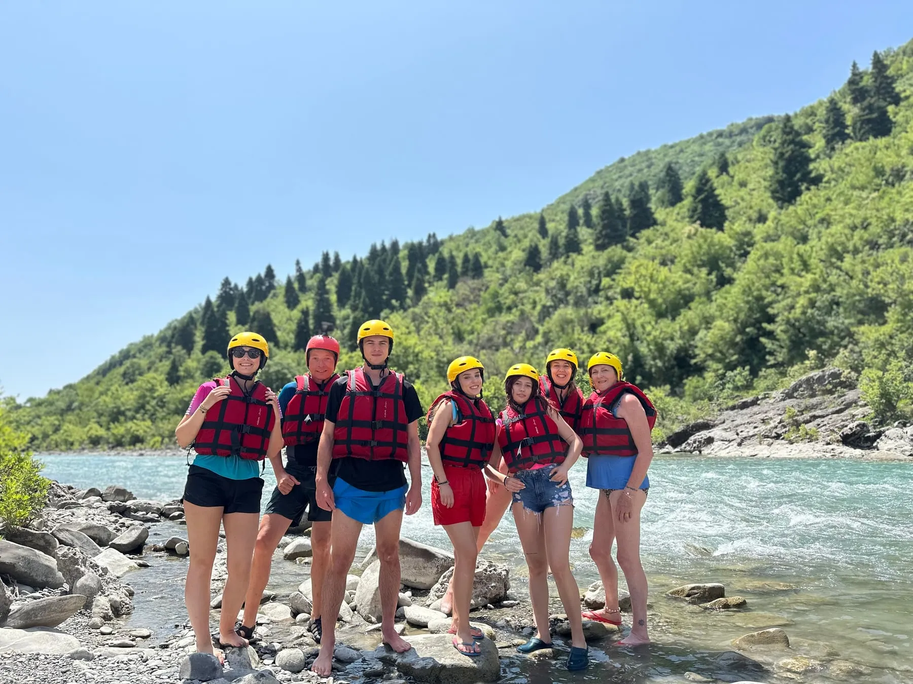 Friends enjoying a sunny river day in Albania